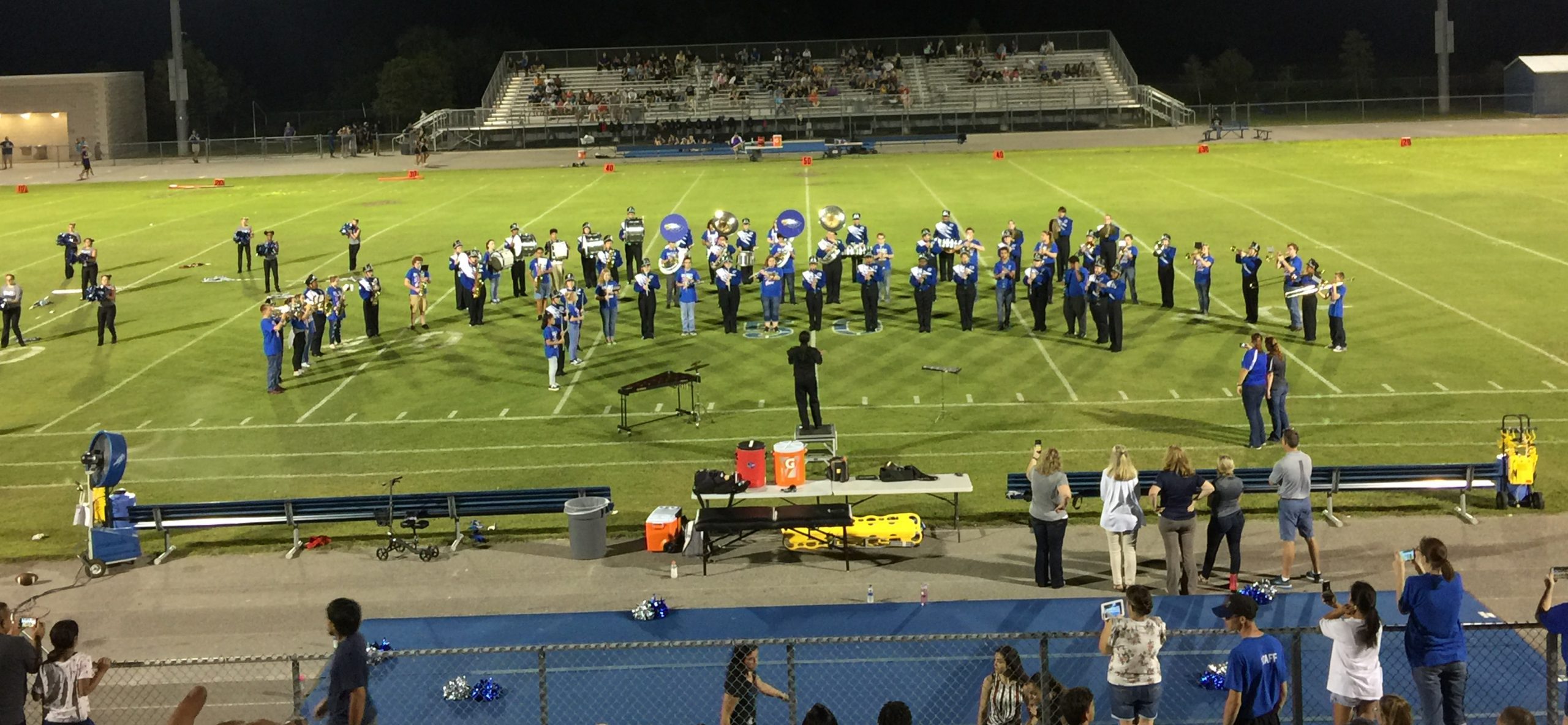 <p>band on football field</p>